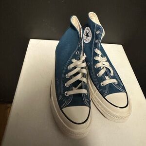 Converse gender inclusive. 
Teal High-Top Sneakers. 
Size in women 8 /men 6